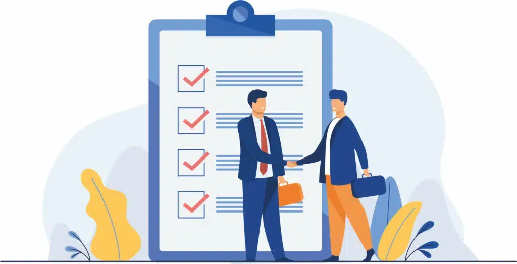 Deux hommes en costume se serrent la main devant une grande check-list sur un tableau, représentant une collaboration professionnelle réussie.